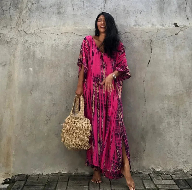 Women's beach kaftan tunic dress in fuchsia pink with vertical tie-dye pattern, side slit