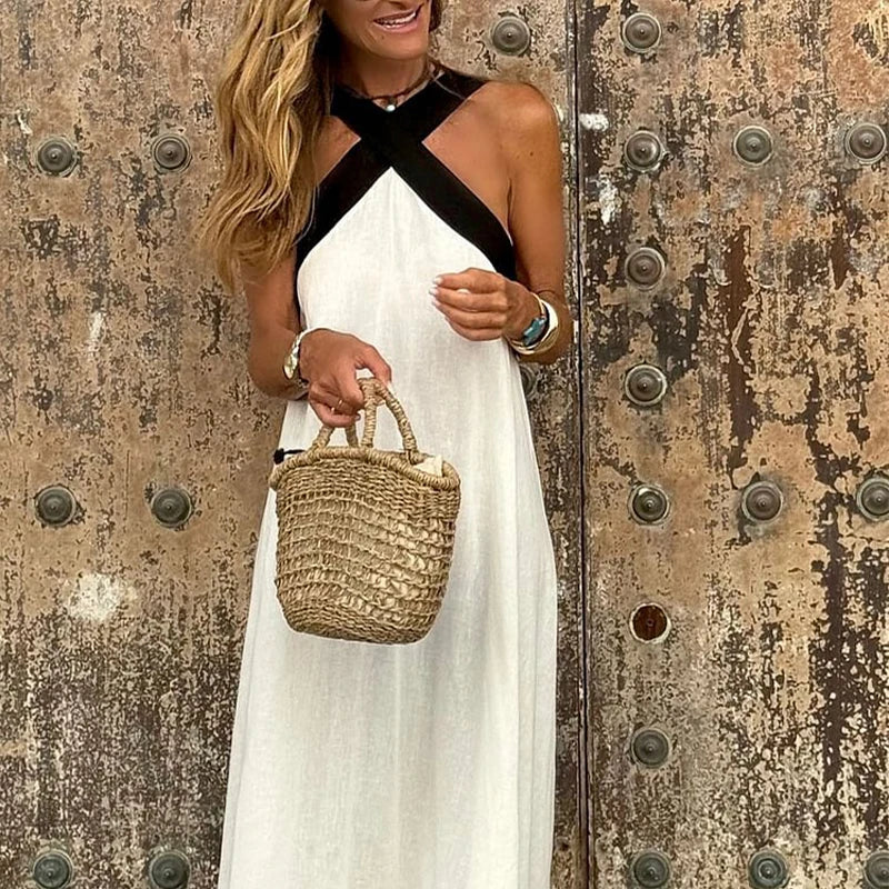 White halter neck linen maxi dress with crisscross halter neckline and relaxed skirt