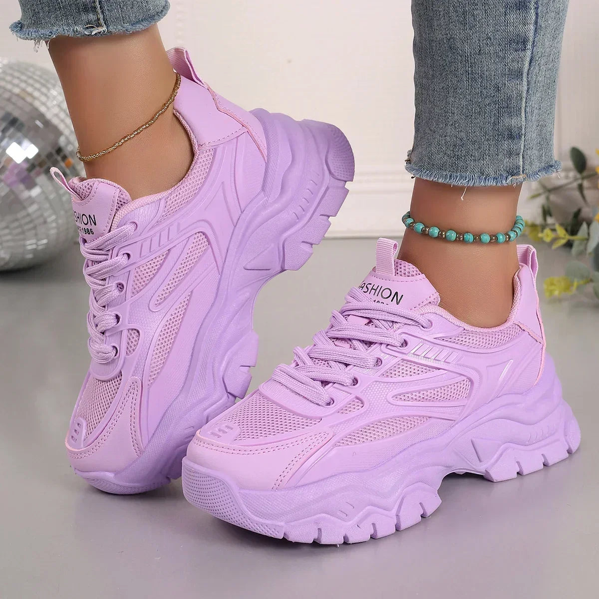 Lavender chunky platform sneakers with lace-up mesh and thick ridged sole
