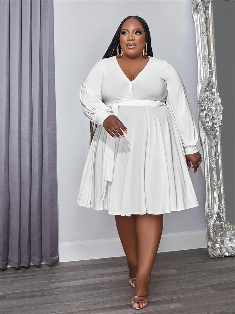 White plus size V-neck long-sleeve dress with pleated A-line skirt