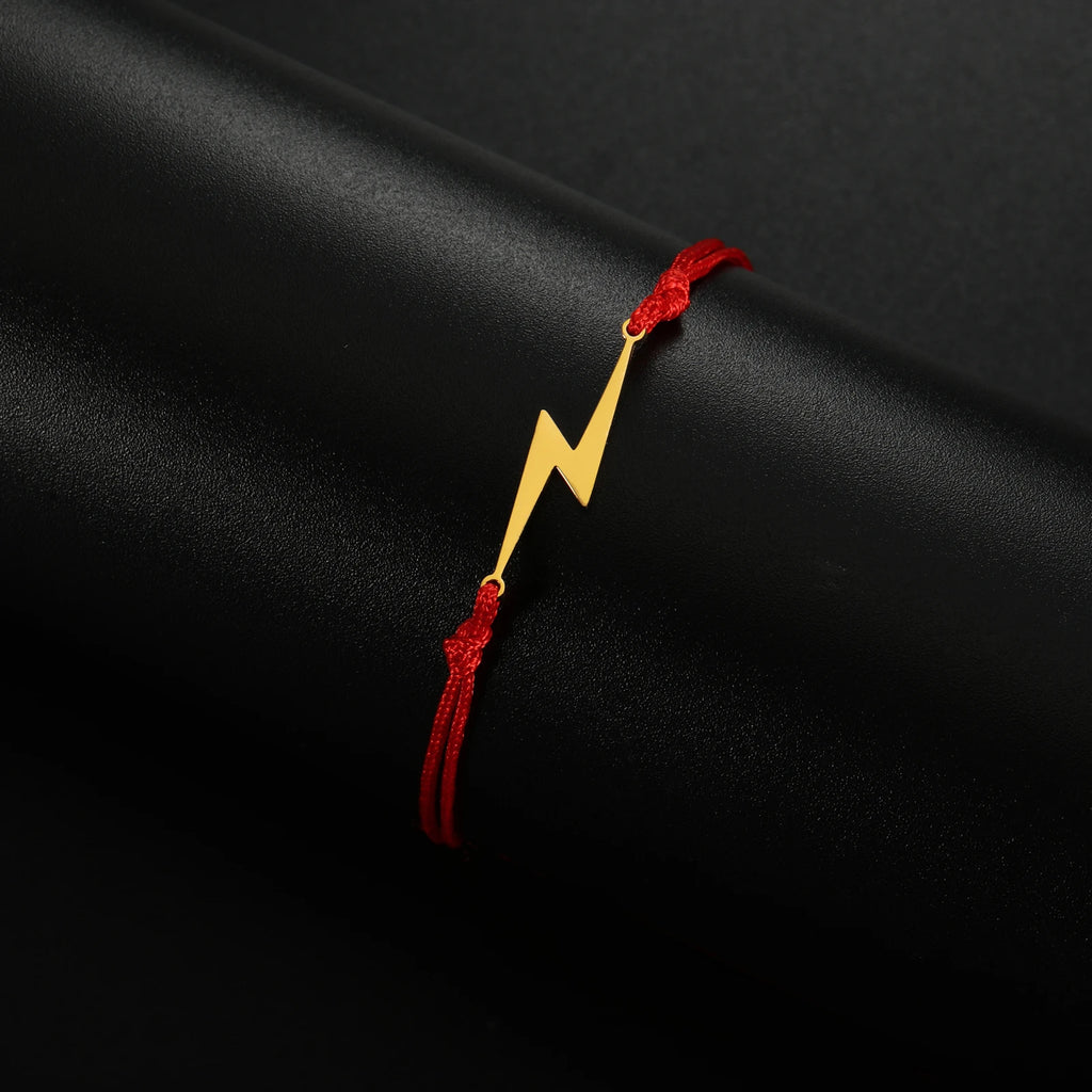 Red braided bracelet with yellow lightning bolt charm, adjustable cord ends