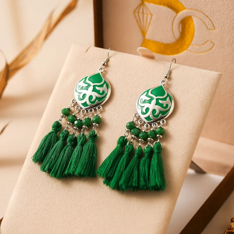 Boho tassel drop earrings with green enamel teardrop charm and green tassels
