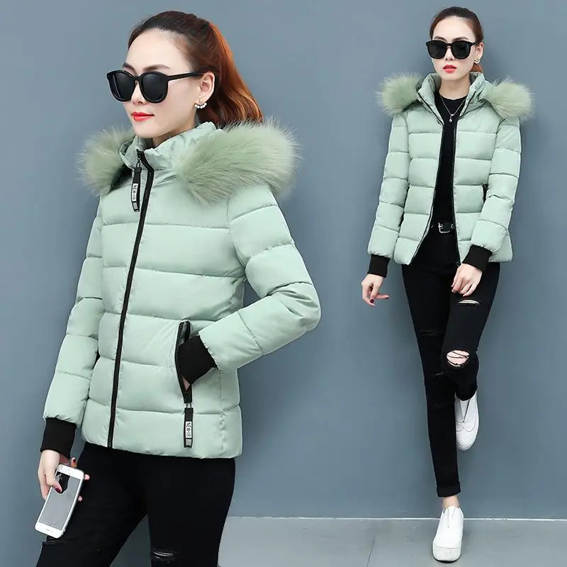 Light green hooded puffer parka with faux fur hood trim and front zipper, quilted body