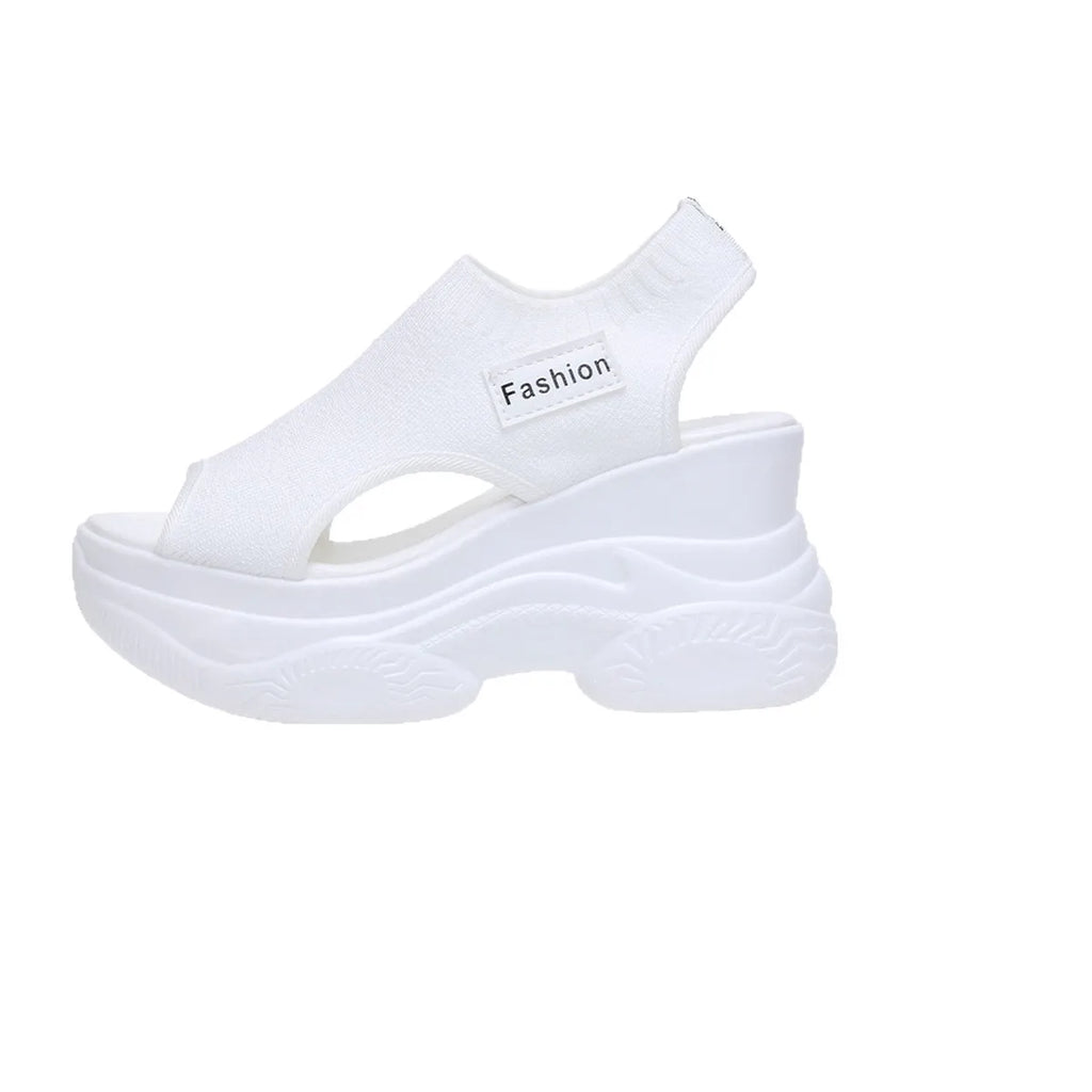White peep-toe platform wedge sandals with stretchy knit upper and layered platform