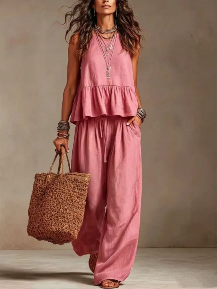 Pink sleeveless tiered ruffle top with matching wide-leg trousers
