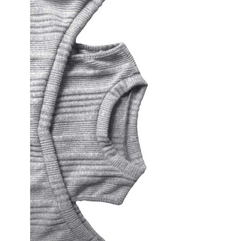 Gray ribbed knit sweater sleeve and cuff close-up with stretchy knit texture