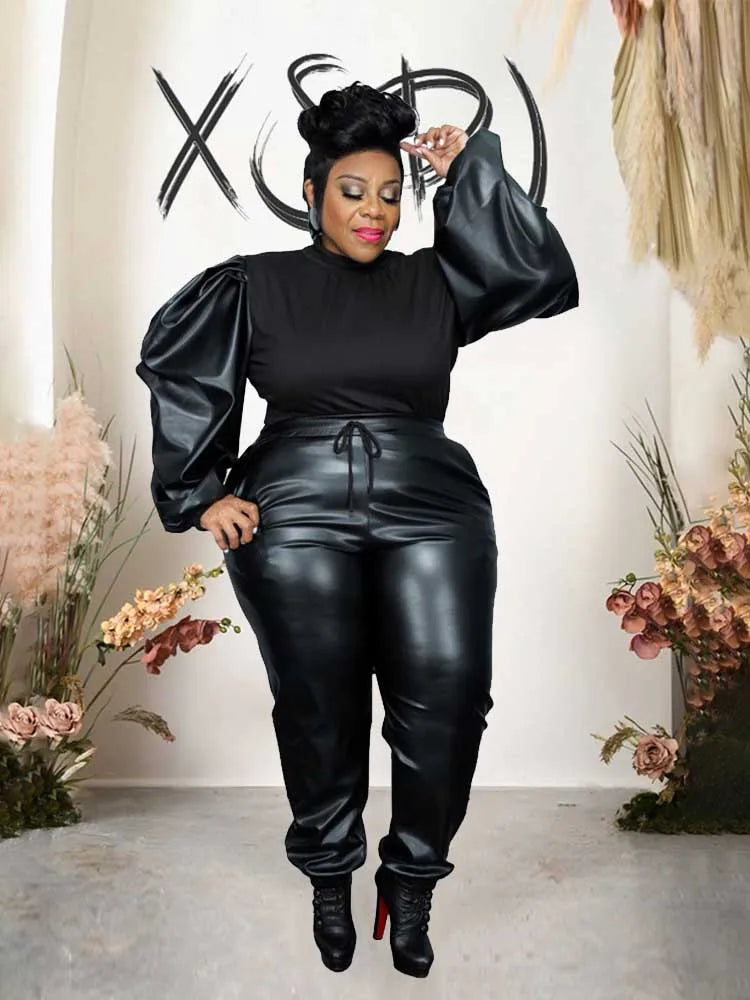 Women's black puff-sleeve knit top and faux leather pants set with ruched waistband