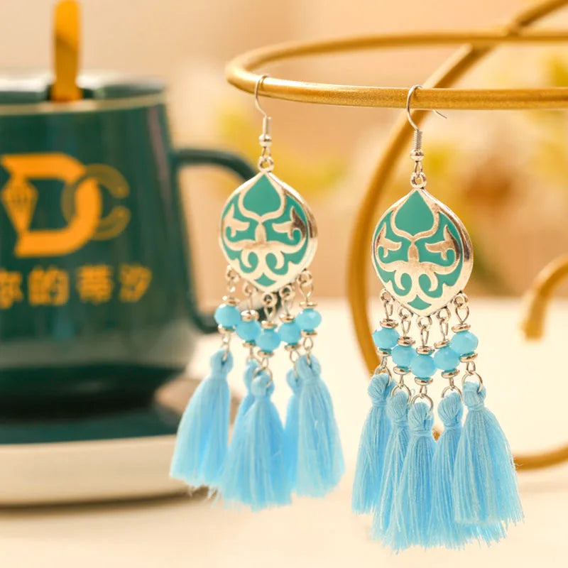 Boho tassel drop earrings with teal enamel teardrop charm and light blue tassels