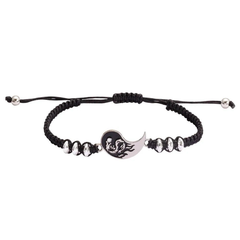 Black cord bracelet with silver charm and black-and-silver bead strand accents