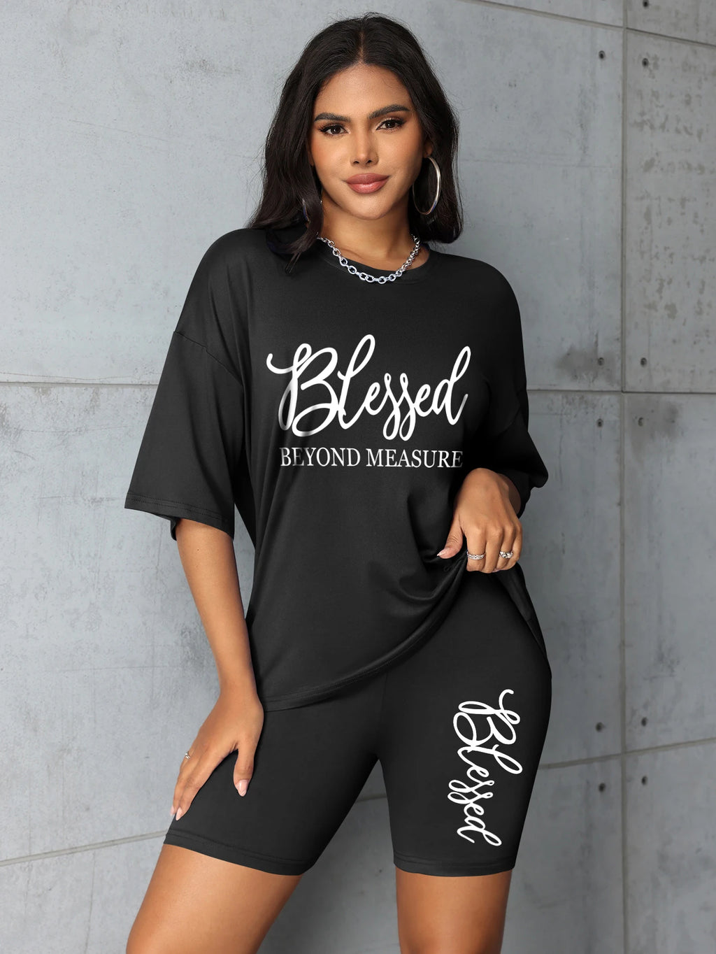 Women's plus size black graphic t-shirt & shorts set with 'Blessed' print