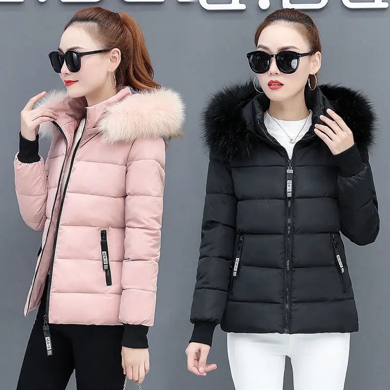 Blush pink hooded puffer parka with faux fur trim and front zipper, quilted front pockets