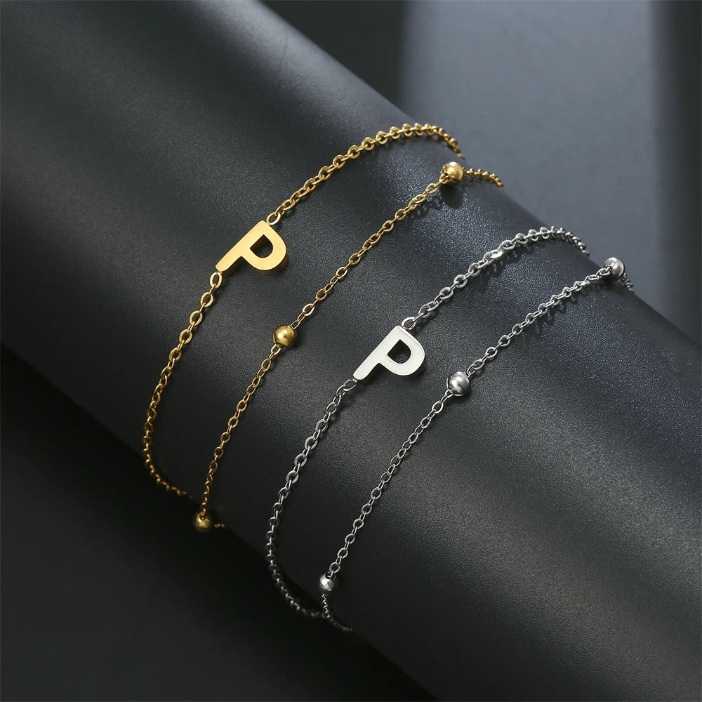 Initial letter bracelet set with B and P charms; gold and silver-tone chains