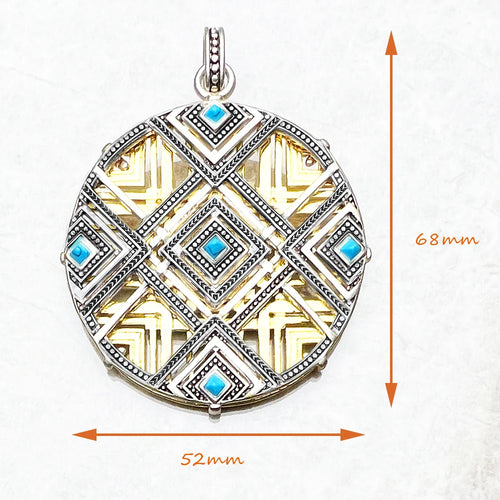 Round sterling silver pendant with gold geometric pattern and blue square insets