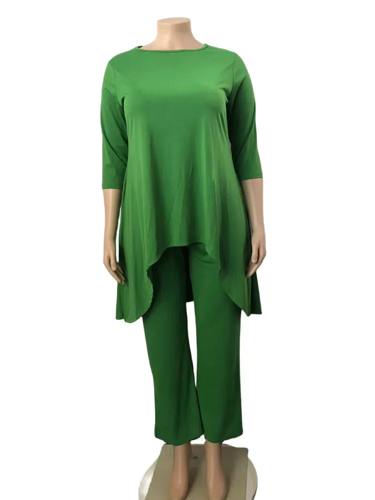 Plus size solid tunic top and pants set, solid green on mannequin