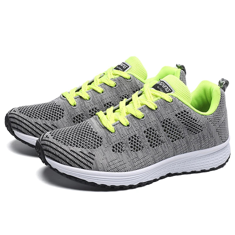 Grey mesh lace-up sneakers with neon green laces and trim, white cushioned sole