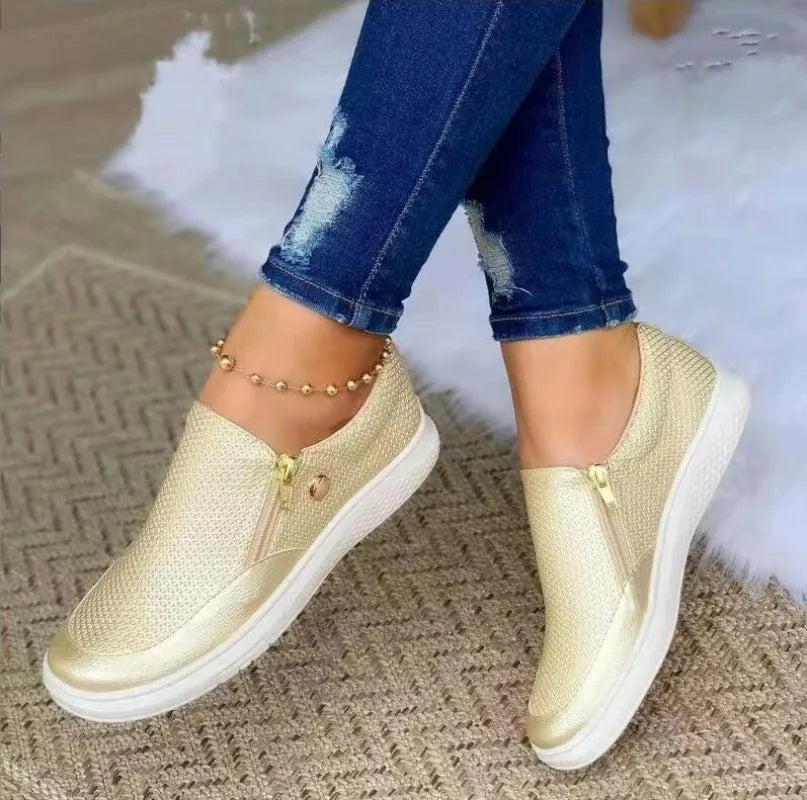 Women’s gold side-zip slip-on sneakers with textured upper and white sole
