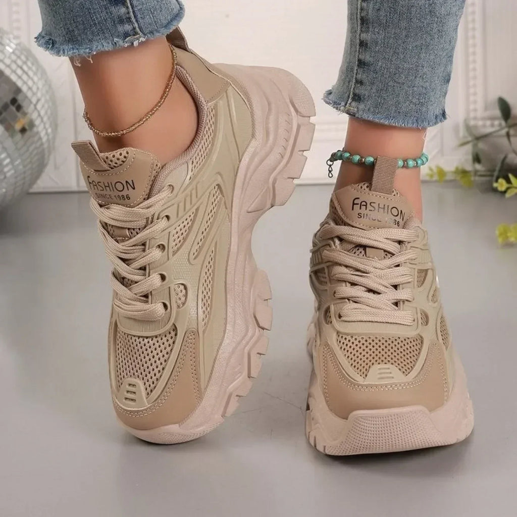Beige chunky platform lace-up sneakers with patterned mesh and treaded sole