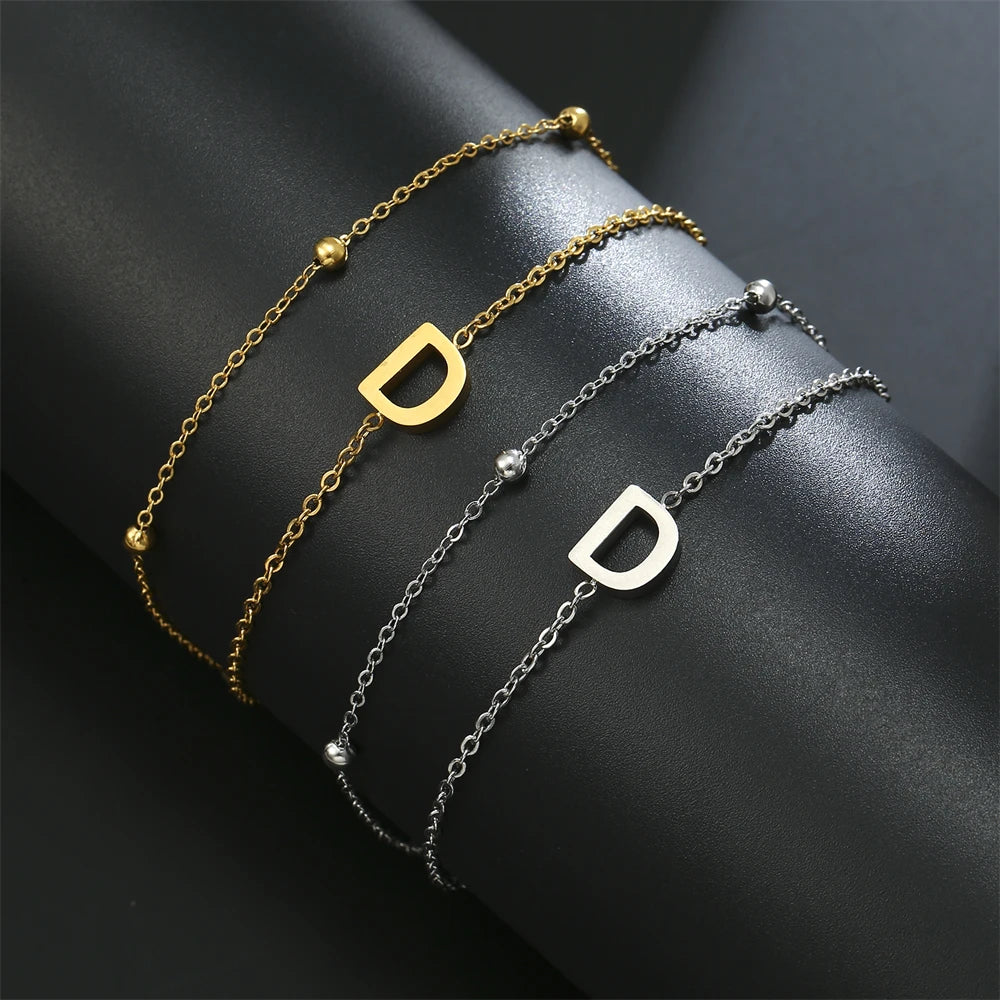 Initial letter bracelet set with D and D charms; gold and silver-tone chains