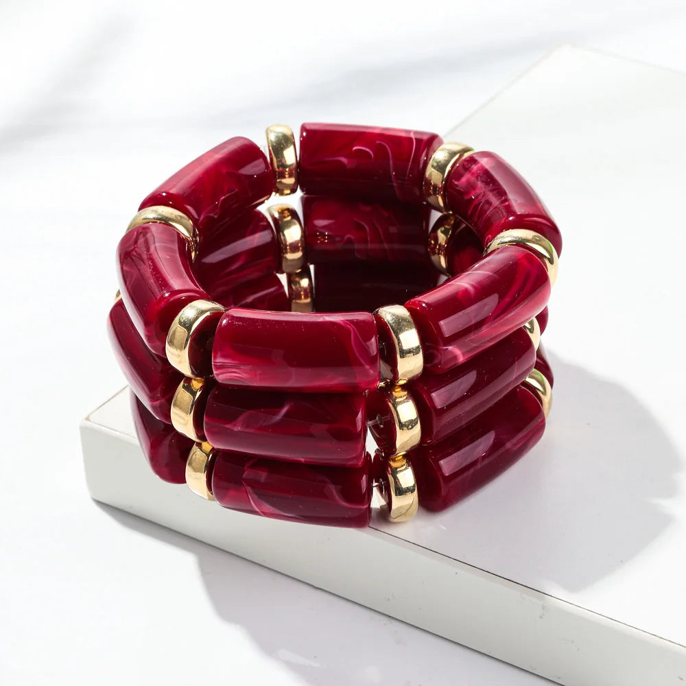 Red bamboo tube bead bracelet set with gold-tone rings, chunky stretch 3-pack