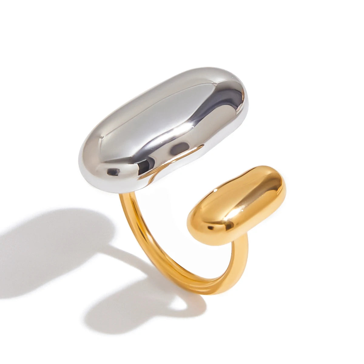 Geometric oval open ring with silver top oval plate and gold inner oval, glossy