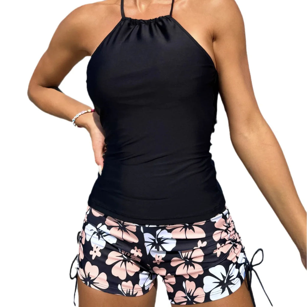 Black halter tankini top with ruched front and floral drawstring swim shorts