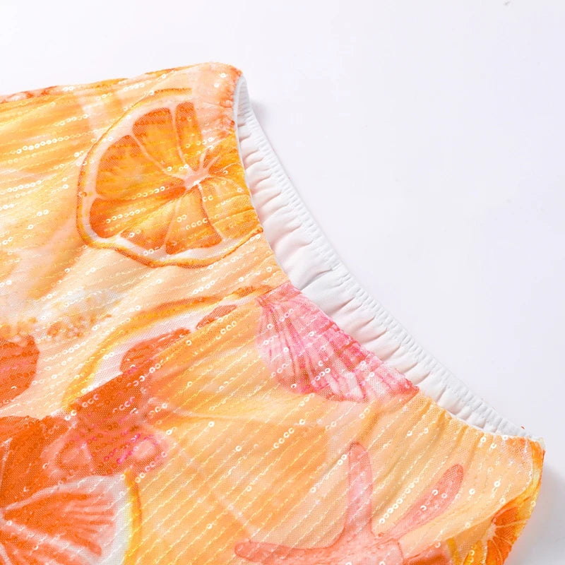 Citrus print crop top with halter neck and ruched elastic neckline