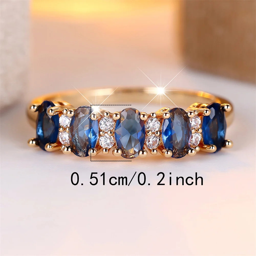 Gold-plated ring with oval blue stones, 0.51 cm (0.2 in) measurement shown