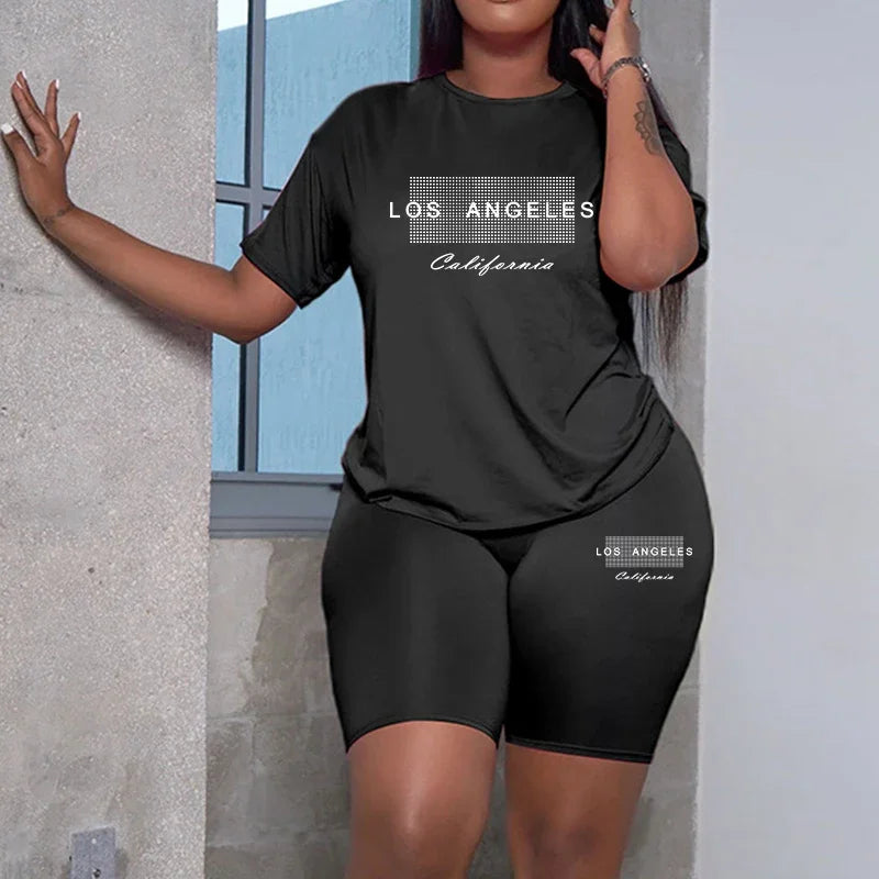 Black women's short-sleeve tee and shorts set with 'Los Angeles' graphic.