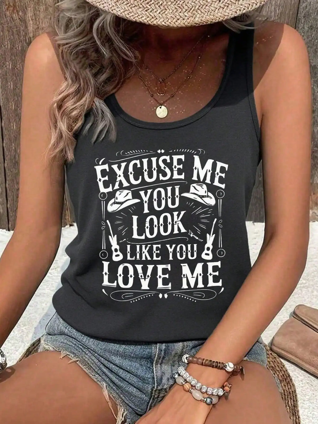 Dark grey racerback tank top with western quote print: “EXCUSE ME…LOVE ME”