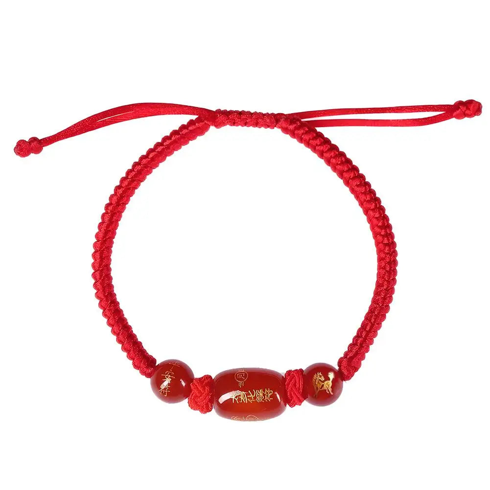 Red braided string bracelet with adjustable knot and zodiac horse bead charm