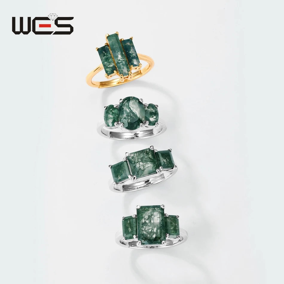 Moss agate rings display, gold-toned three-stone ring and two single-stone styles below