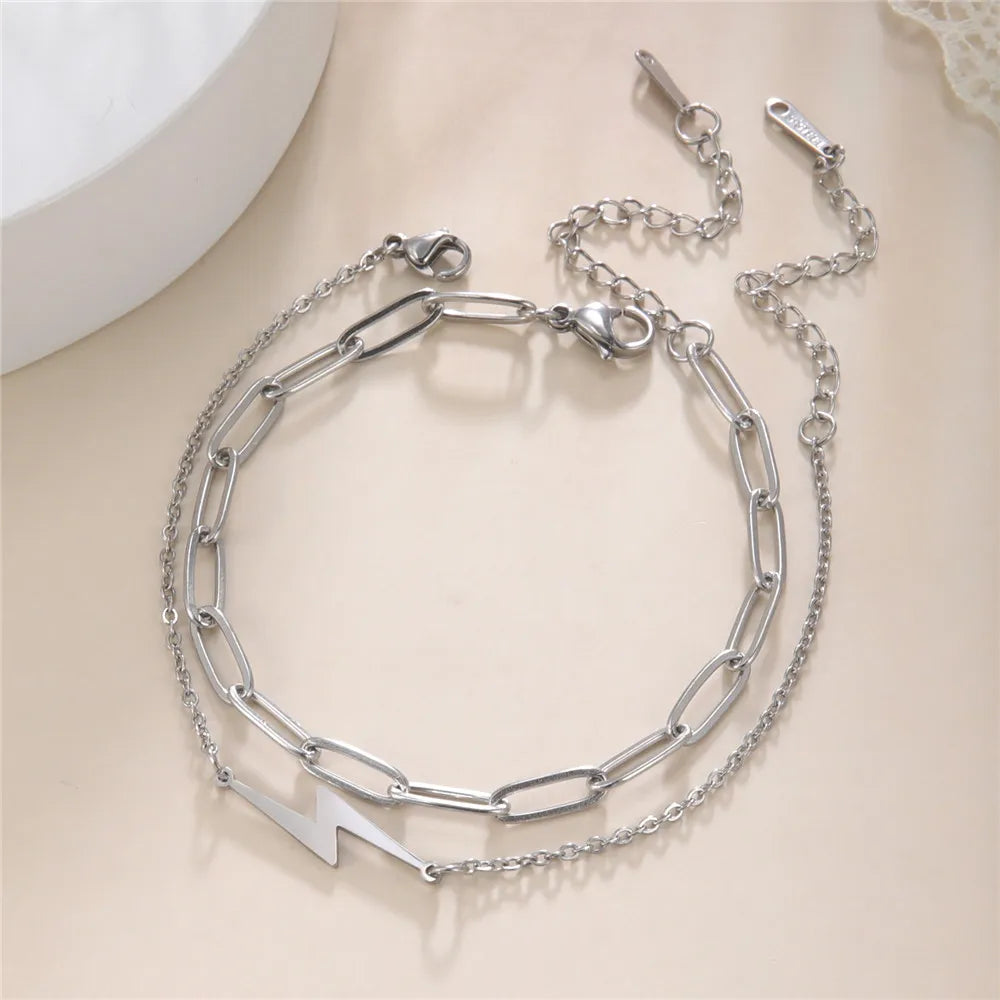 Stainless steel chain charm bracelet with lightning bolt and bar links