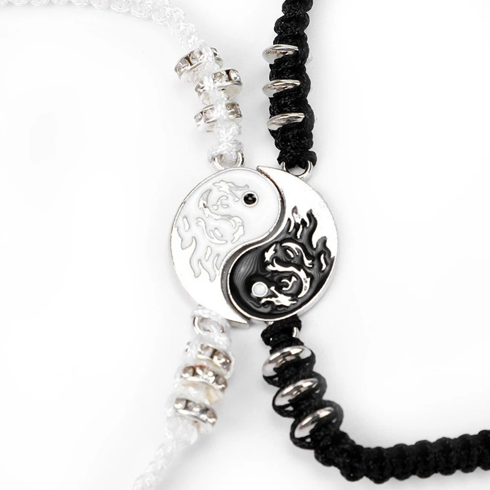 Yin-yang dragon charm bracelet with black cord, silver beads, and circular pendant