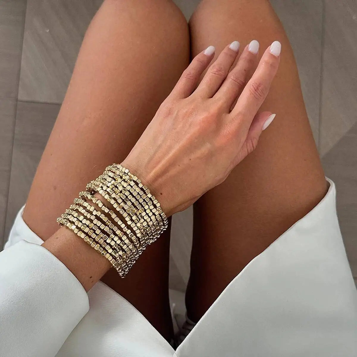 Wide beaded cuff bracelet with silver-tone square beads, multi-row punk style.