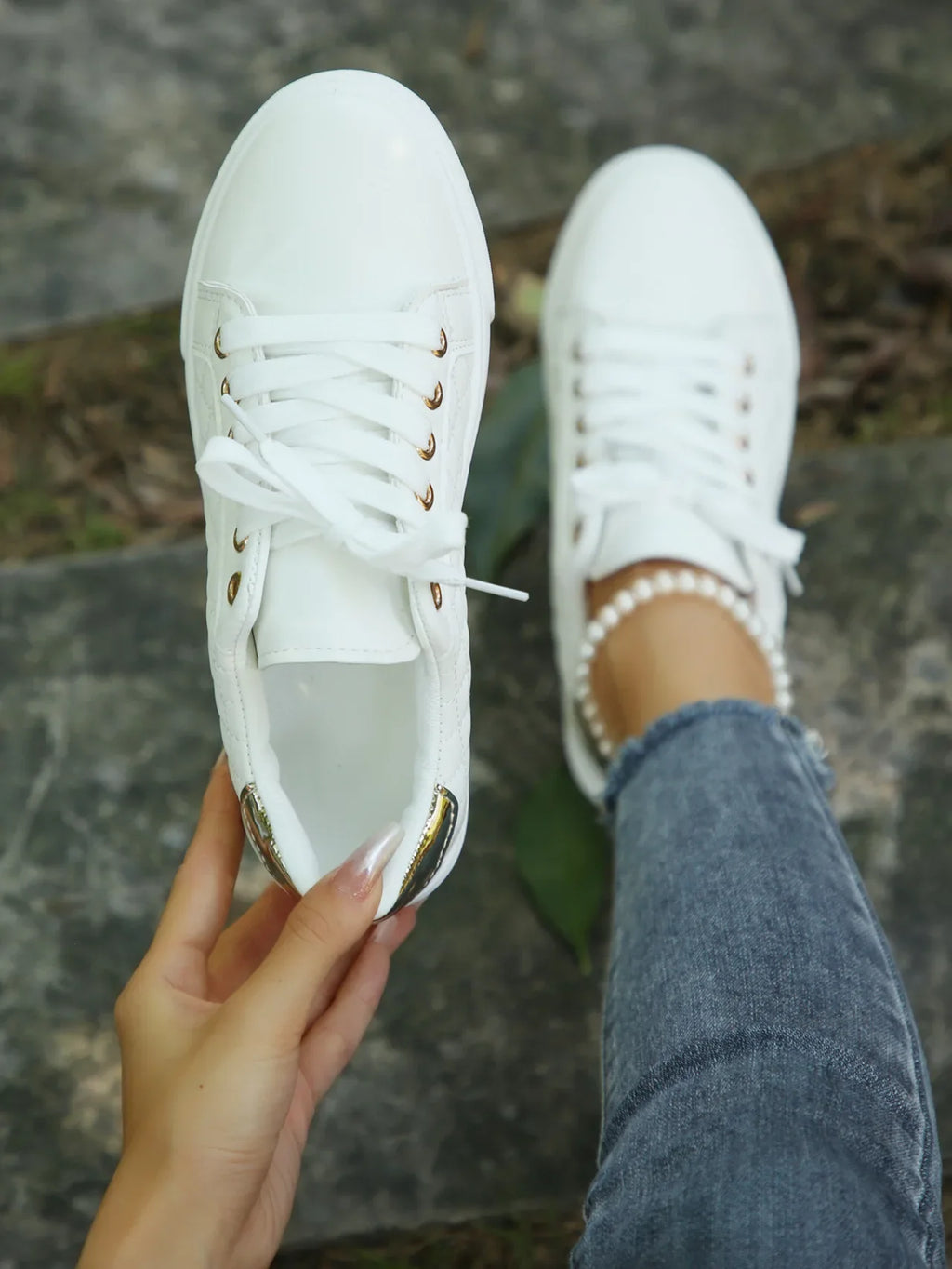 White lace-up platform sneakers with gold eyelets and textured quilted uppers