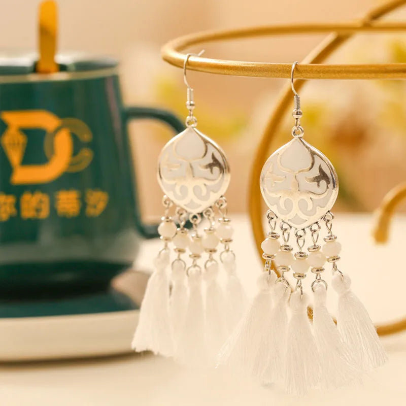 Boho tassel drop earrings with white enamel teardrop charm and white tassels