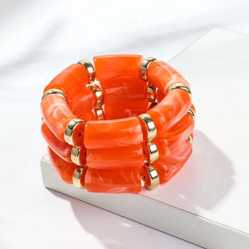 Orange bamboo tube bead bracelet set with gold-tone rings, chunky stretch 3-pack