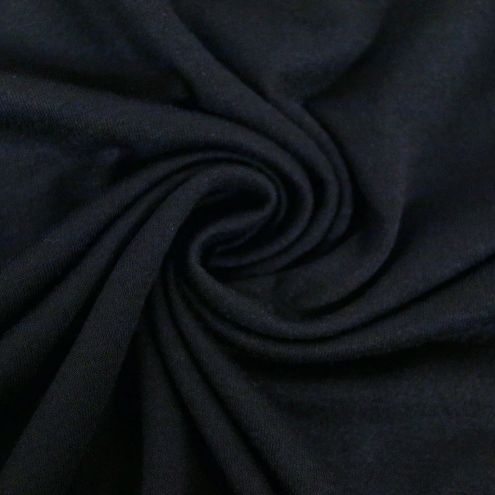 Black fabric fold detail on sleeveless top, smooth knit texture