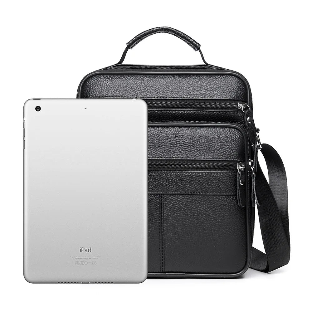 Black leather crossbody bag with top handle, front zip pockets, fits tablet/iPad