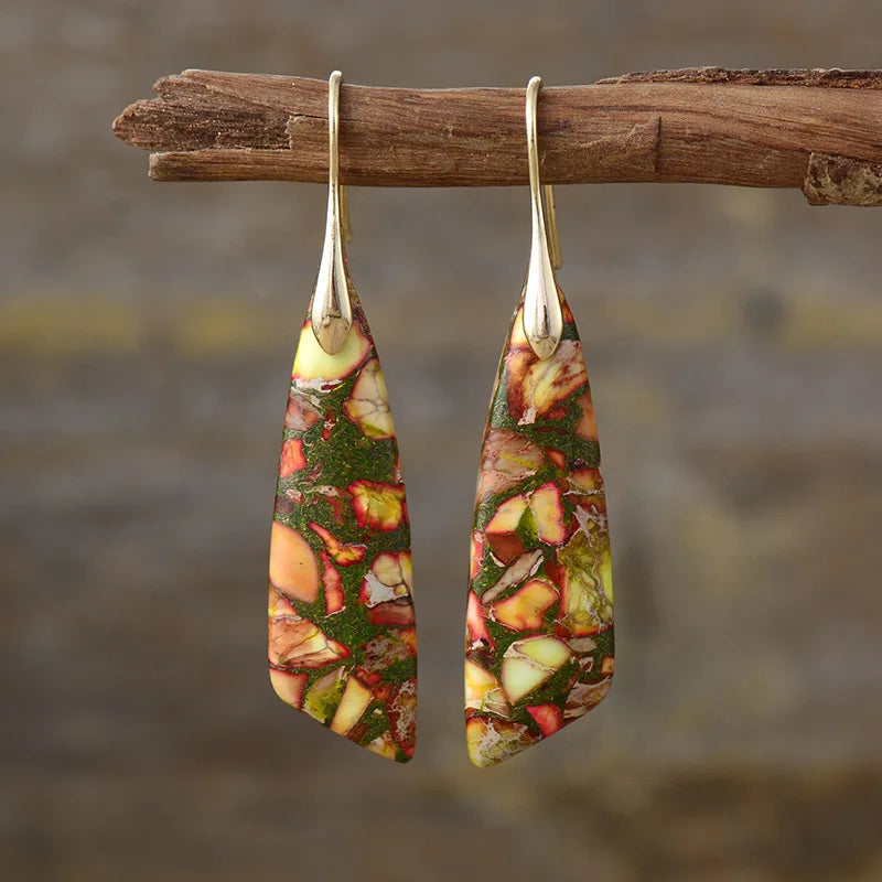 Gold-tone natural stone drop earrings with red, green, and yellow mottled teardrop panels