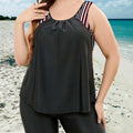 Black tankini top with matching swim shorts, striped detail on shoulder strap