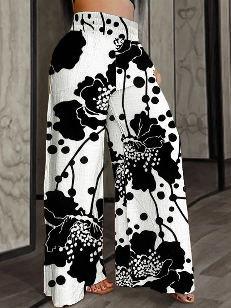 Women’s plus size wide-leg pants, white with black floral and dot abstract print, high waist