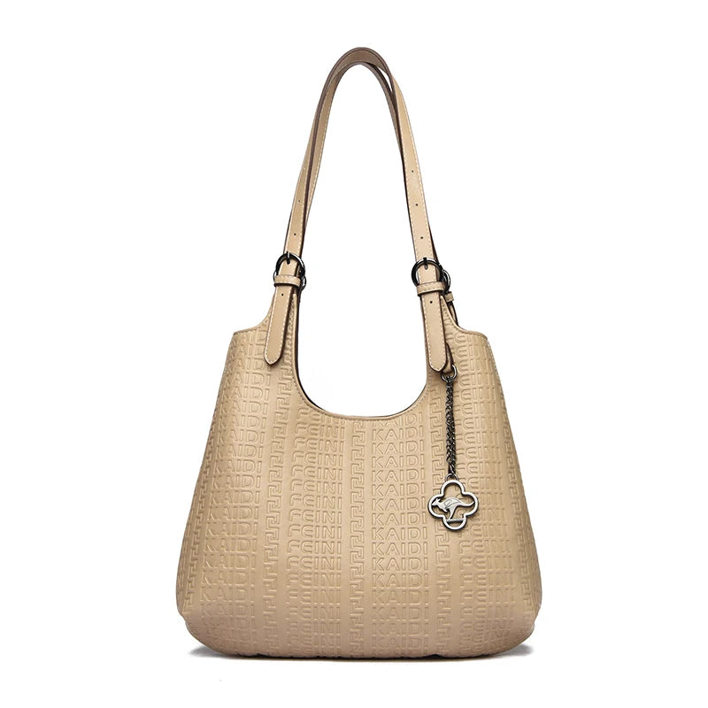 Beige embossed leather shoulder tote with top handles and flower logo charm