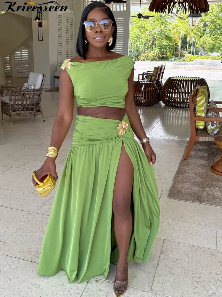 Green off-shoulder cropped top and high-slit maxi skirt set, flower brooch detail
