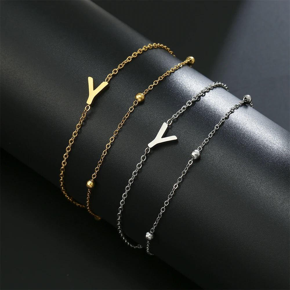 Initial letter bracelet set with Y and L charms; gold and silver-tone chains