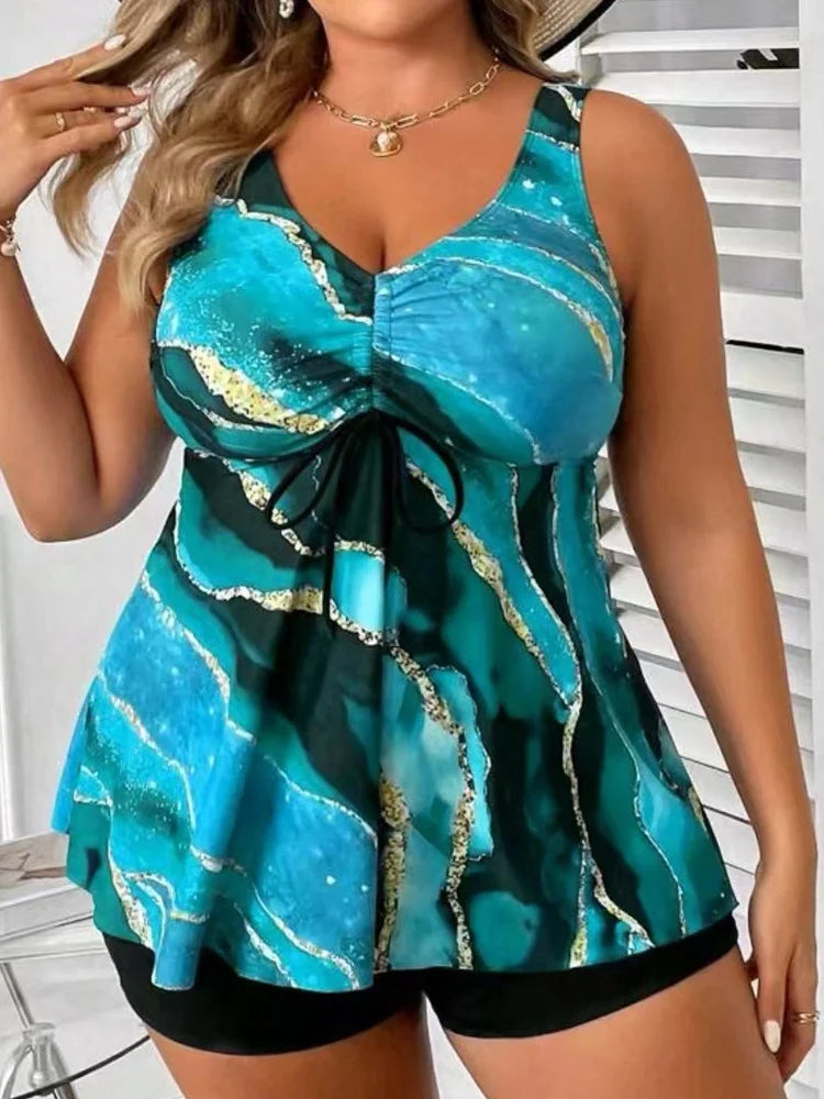 Women’s plus size strappy tankini set, teal and blue abstract print with black high-rise bottoms