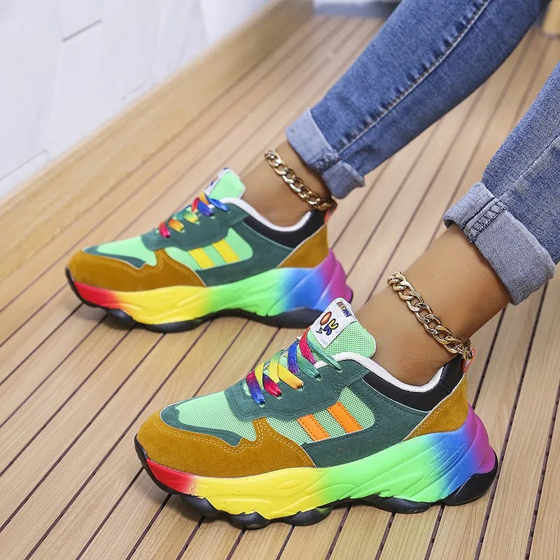Colorful platform sneakers with green and teal panels, rainbow sole, and chain detail